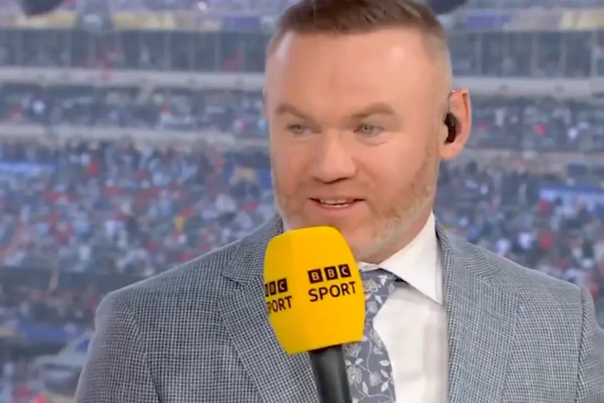 Presenter speaking into microphone during live broadcast