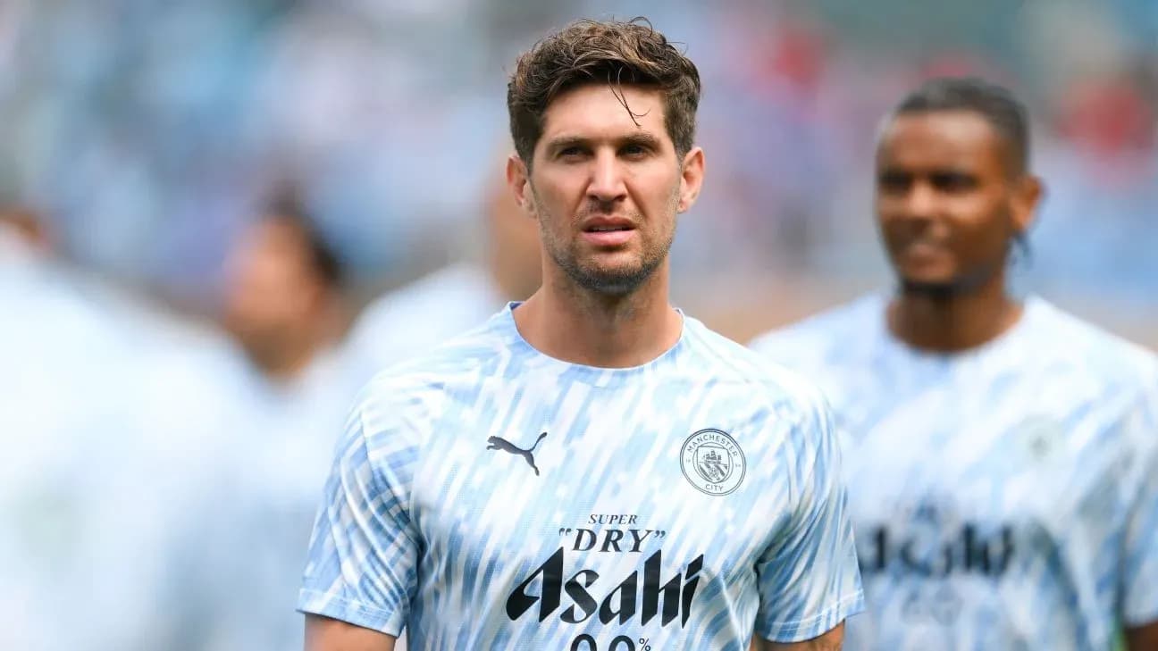 Player in Manchester City training kit on pitch