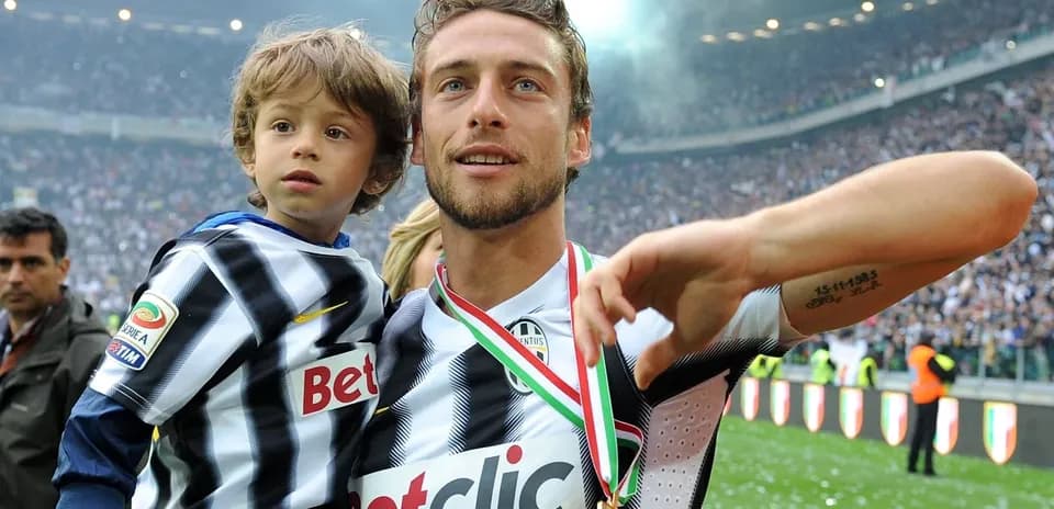 Player celebrating with child after winning match
