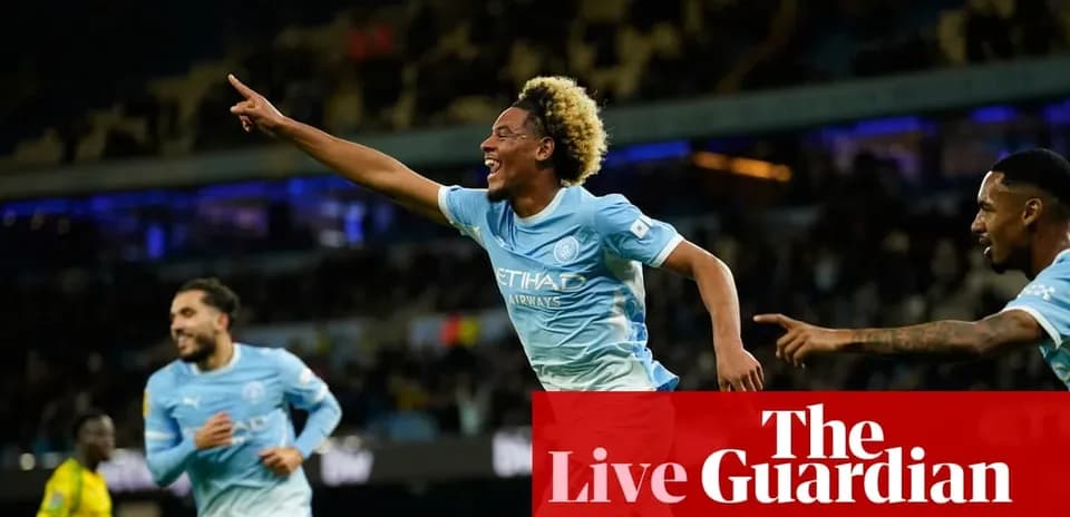 Player celebrating goal with teammates at stadium