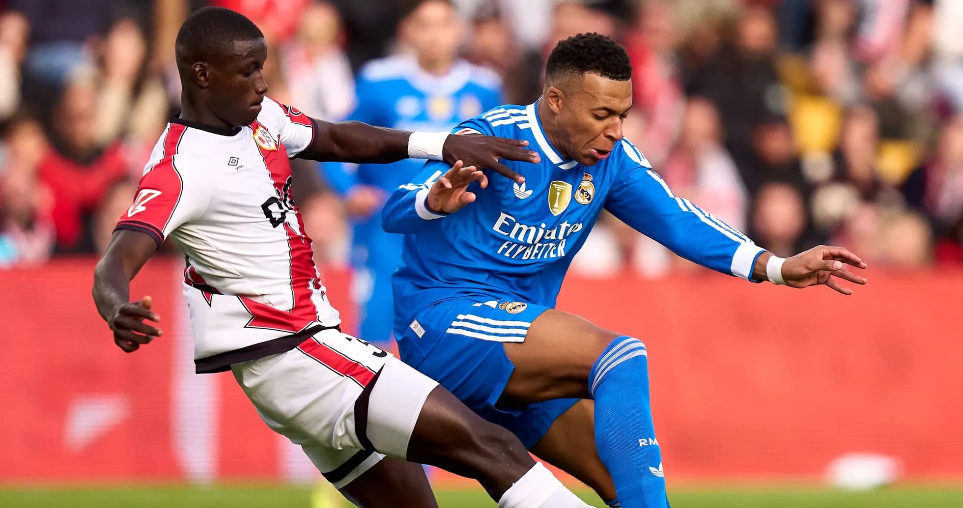 Two players challenging for the ball during match