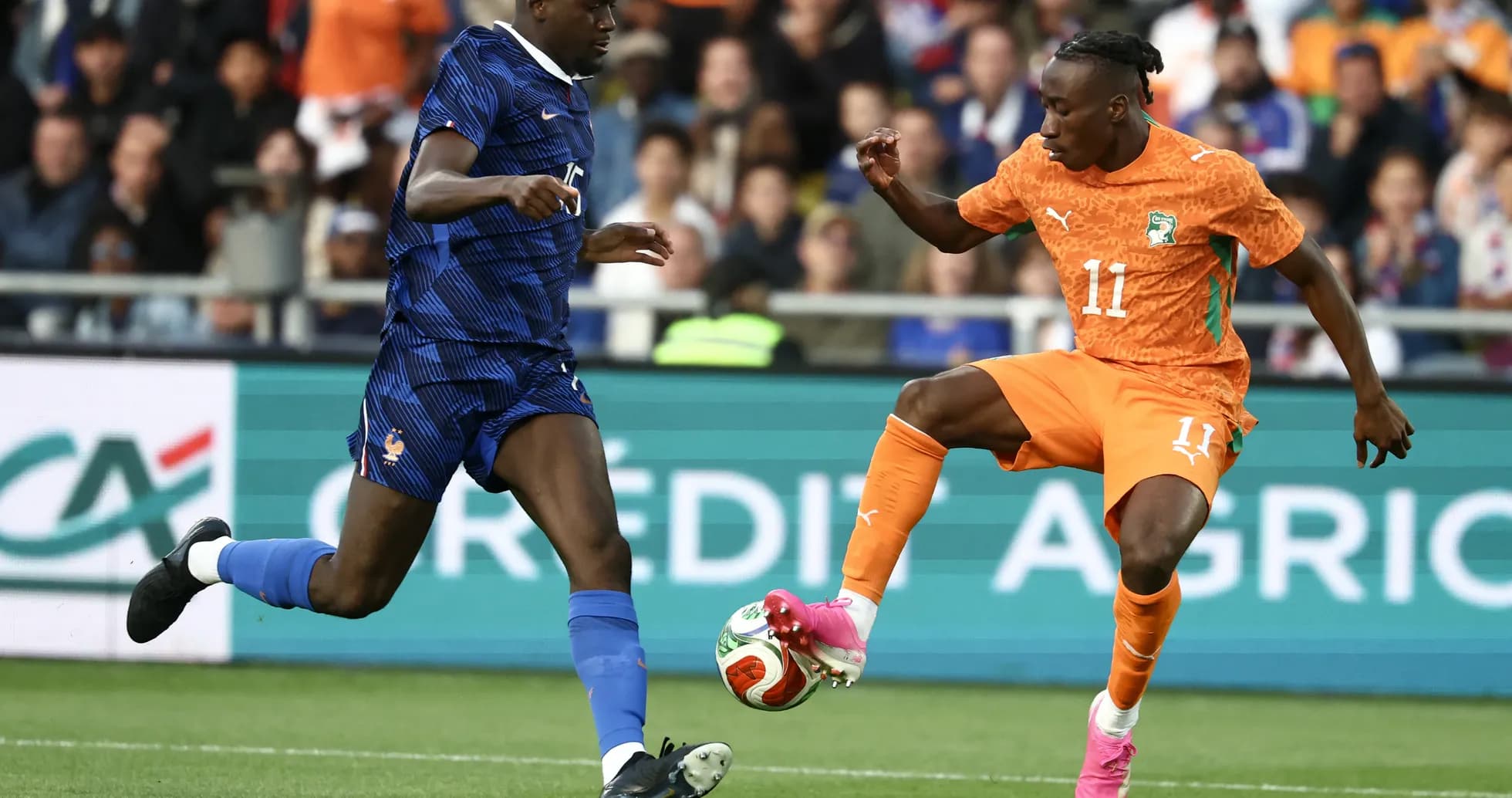 Two players competing for the ball during match