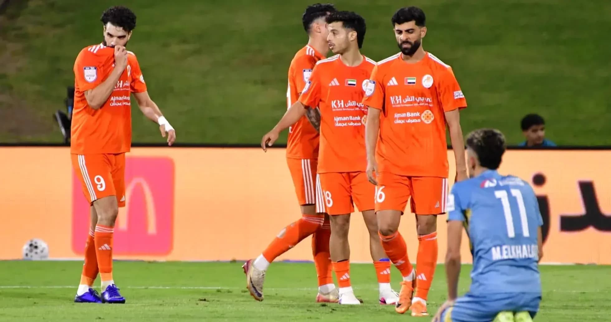 Ajman U23 players celebrating on the field