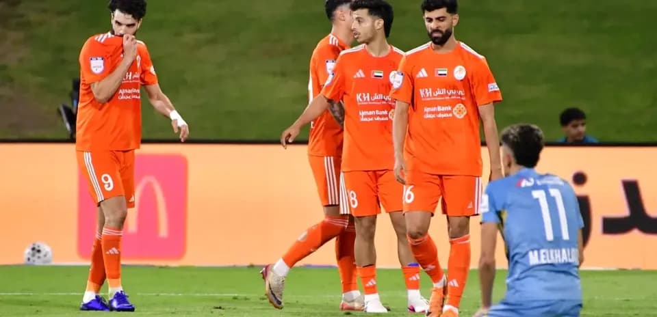 Ajman U23 players celebrating on the field