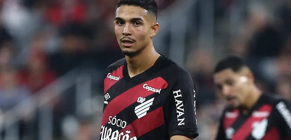 Player in red and black kit during match