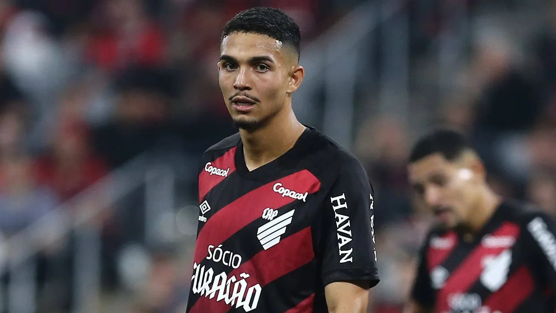 Player in red and black kit during match