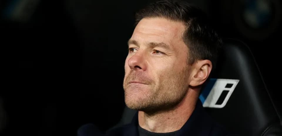 Coach sitting on bench during a match