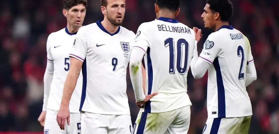 England players discussing strategy during match