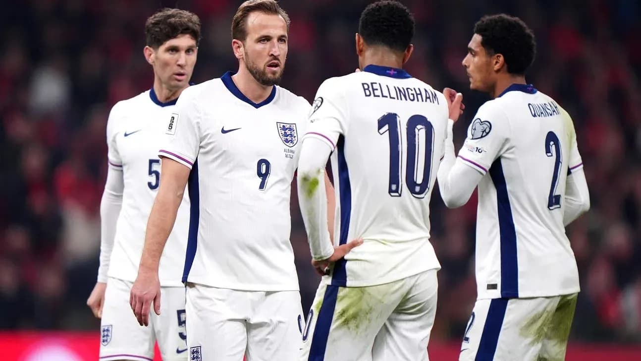 England players discussing strategy during match