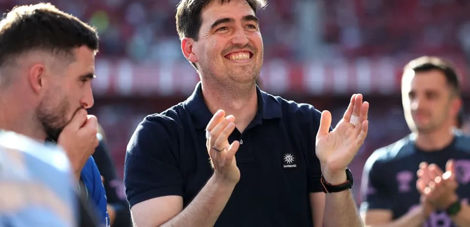 Man applauding with teammates during match celebration