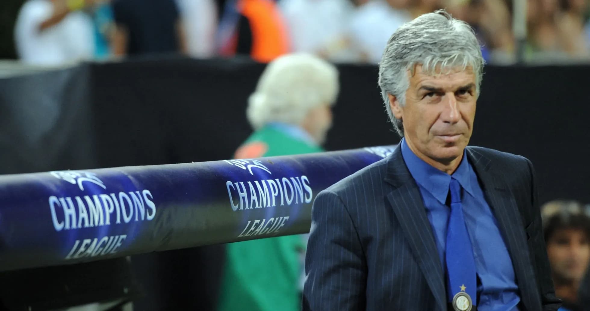 Coach sitting on the bench during Champions League match