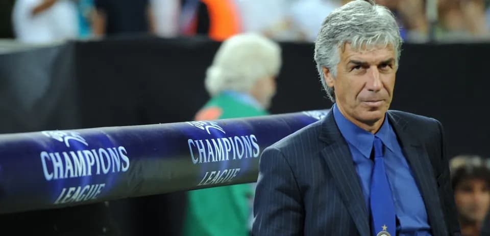 Coach sitting on the bench during Champions League match