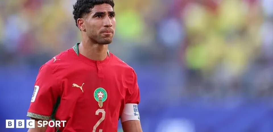 Morocco player wearing red jersey on the field