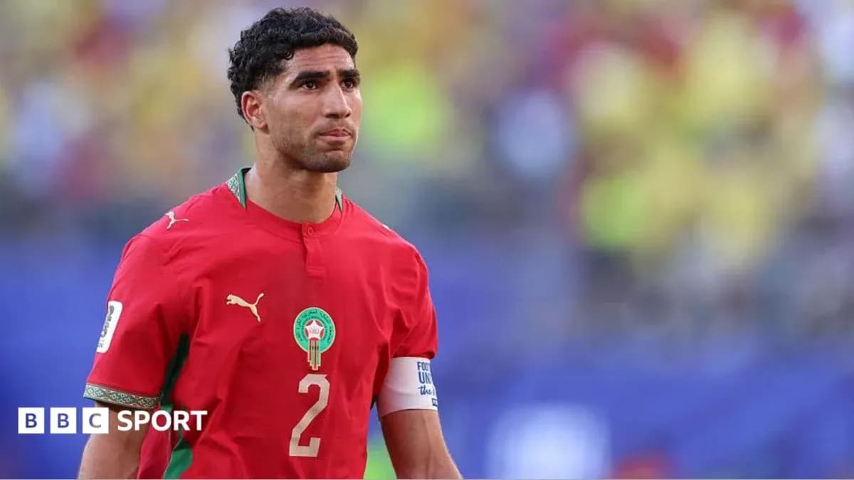 Morocco player wearing red jersey on the field
