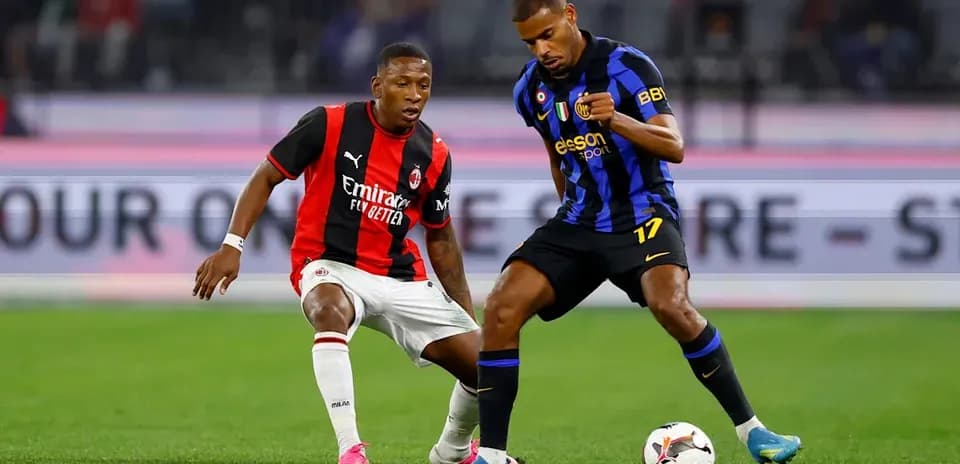 Two players competing for the ball in match