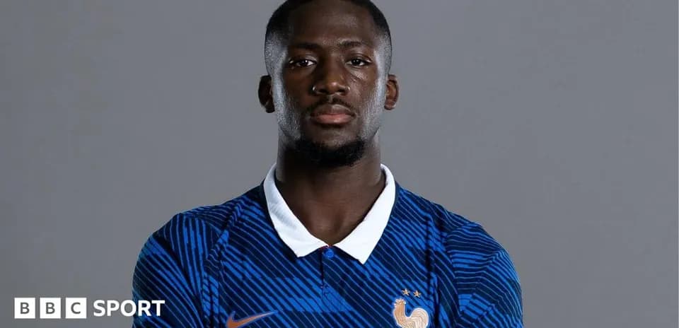 Football player posing in France national team jersey