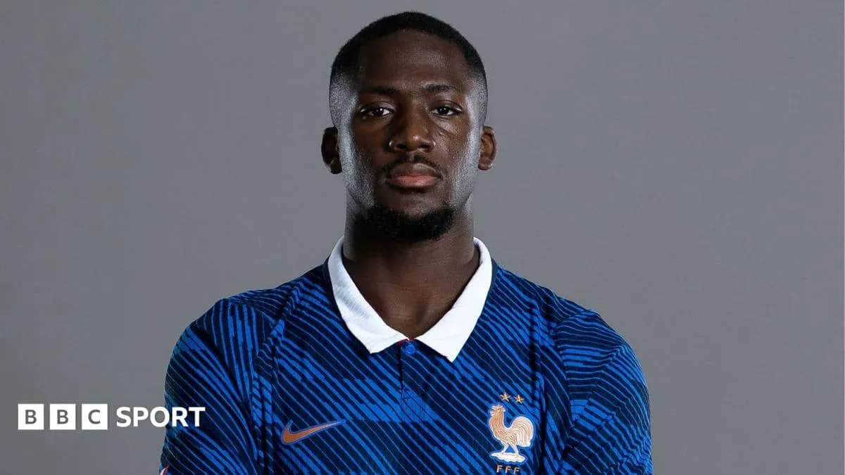 Football player posing in France national team jersey