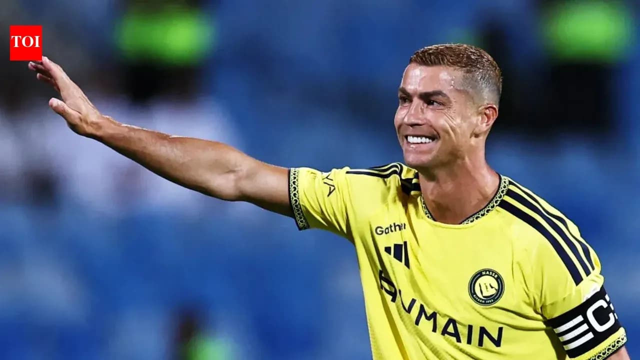 Cristiano Ronaldo waving while in yellow jersey
