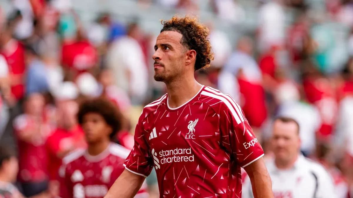 Liverpool player walking off the pitch after match
