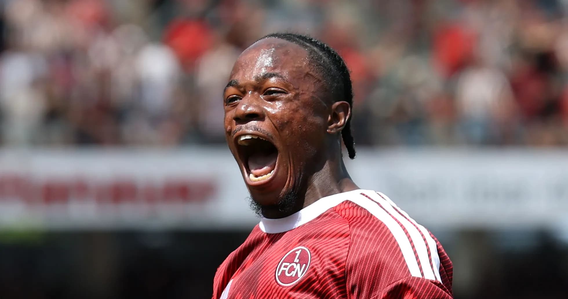 Player celebrating passionately during a football match
