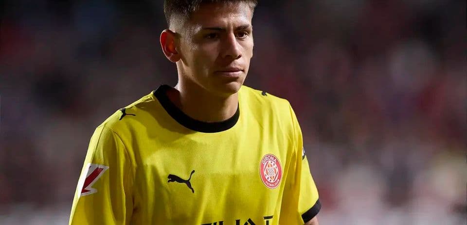 Goalkeeper in yellow jersey walking on the pitch