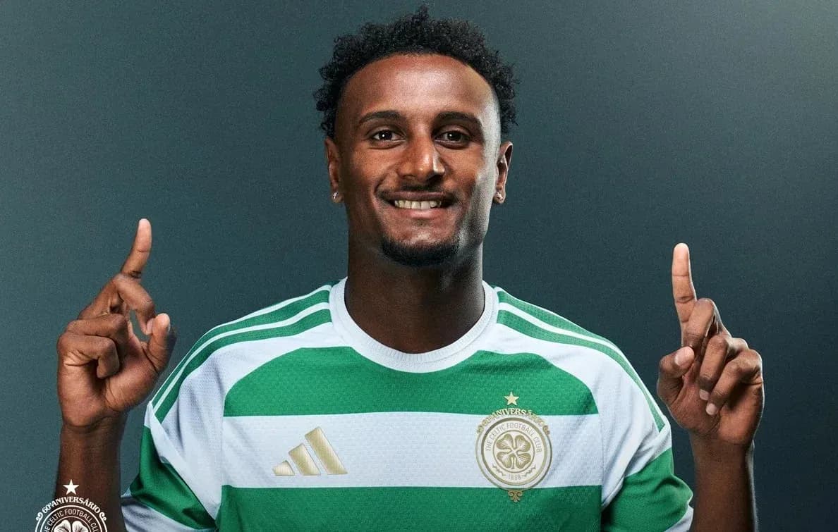 Player in green and white jersey posing for photo