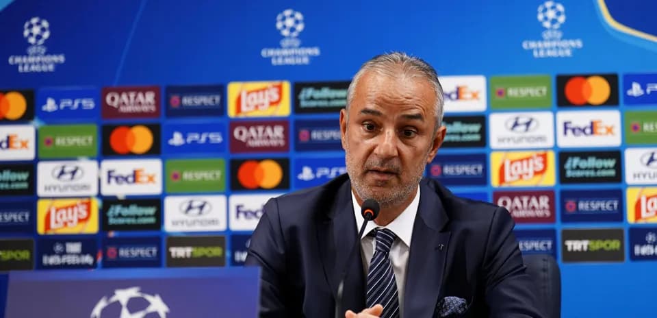 Coach speaking at UEFA Champions League press conference