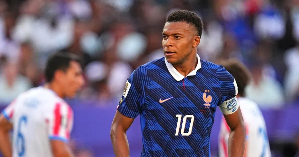 Kylian Mbappé wearing France jersey during match