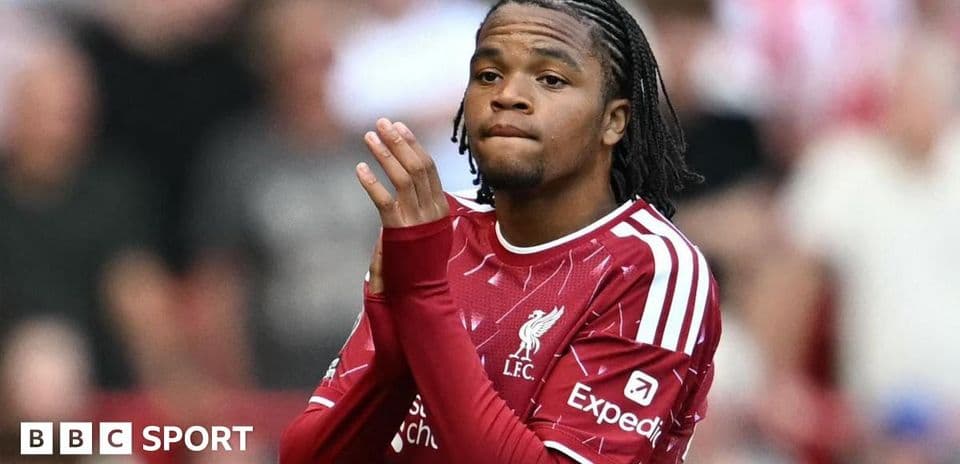 Player in Liverpool kit clapping to fans