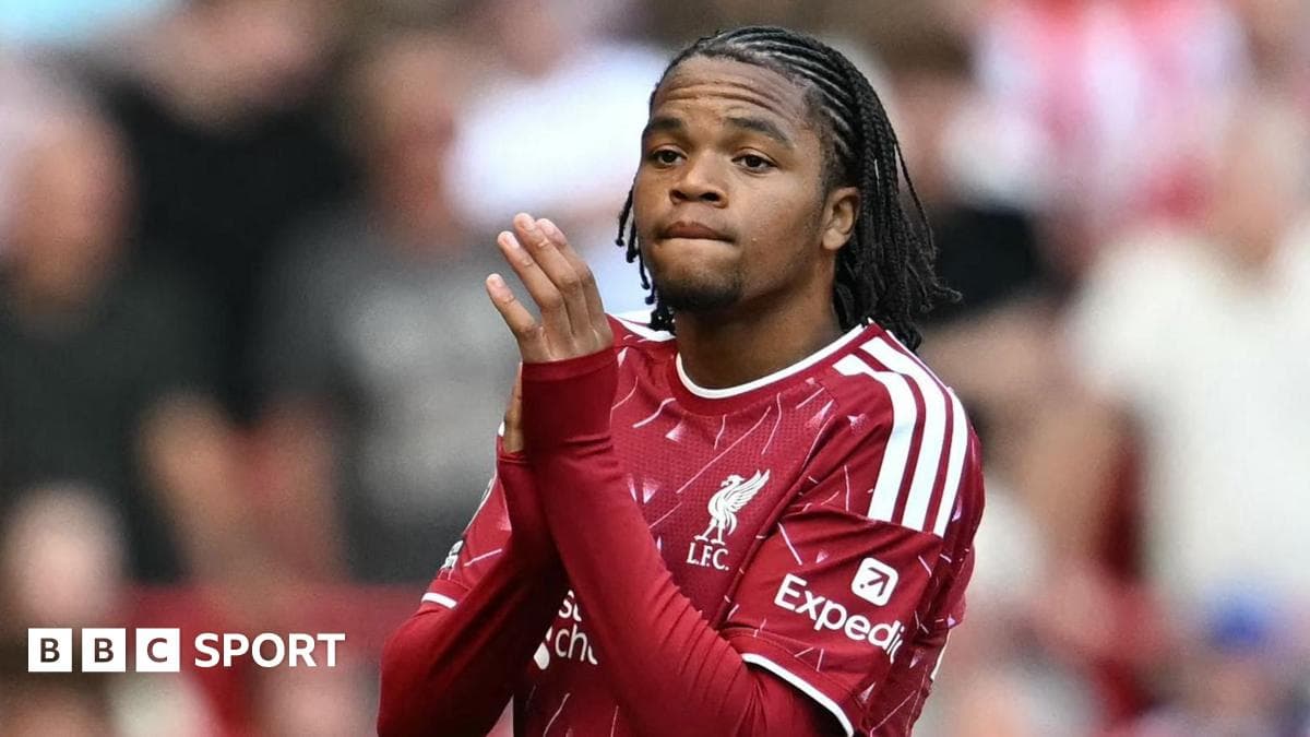 Player in Liverpool kit clapping to fans