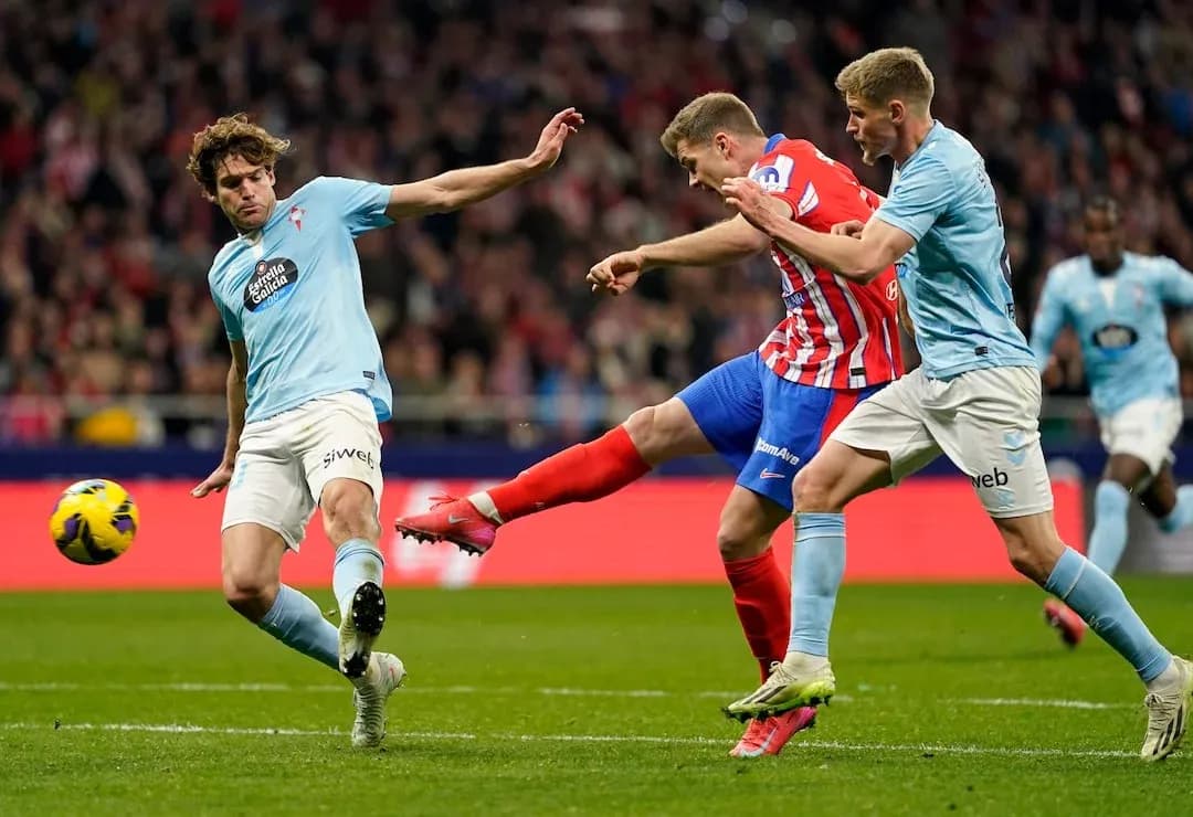 Atletico Madrid player shooting during match