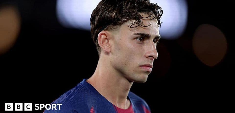 Player in Barcelona jersey during match introspection
