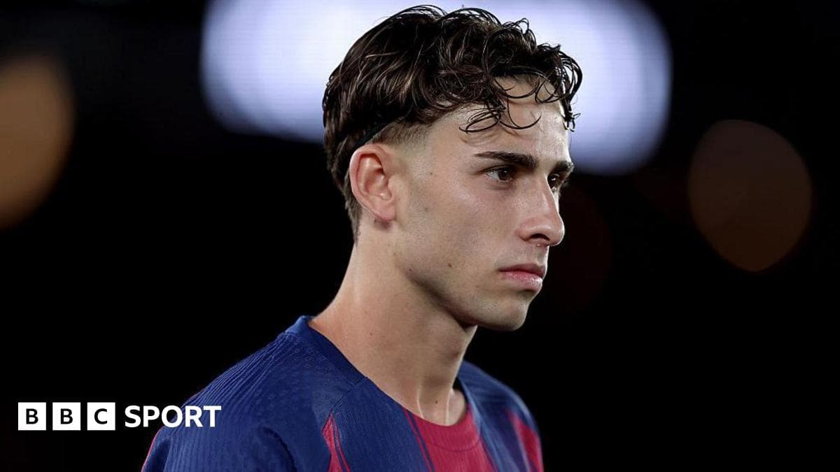 Player in Barcelona jersey during match introspection