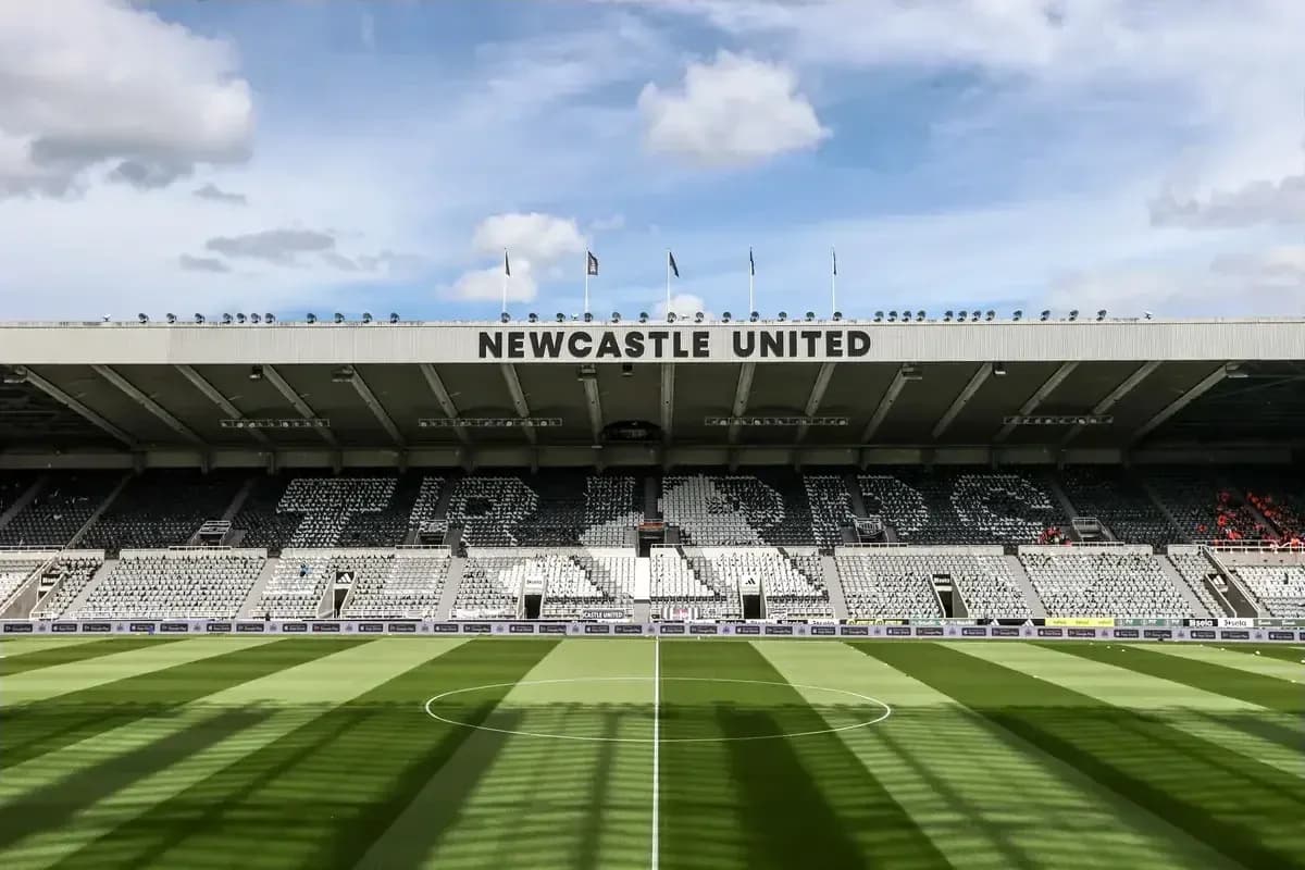 Stadium interior with Newcastle United signage and seating