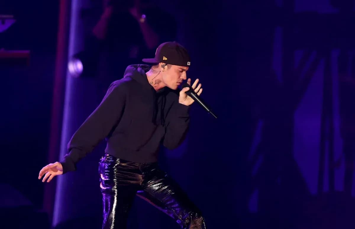 Performer singing on stage with microphone