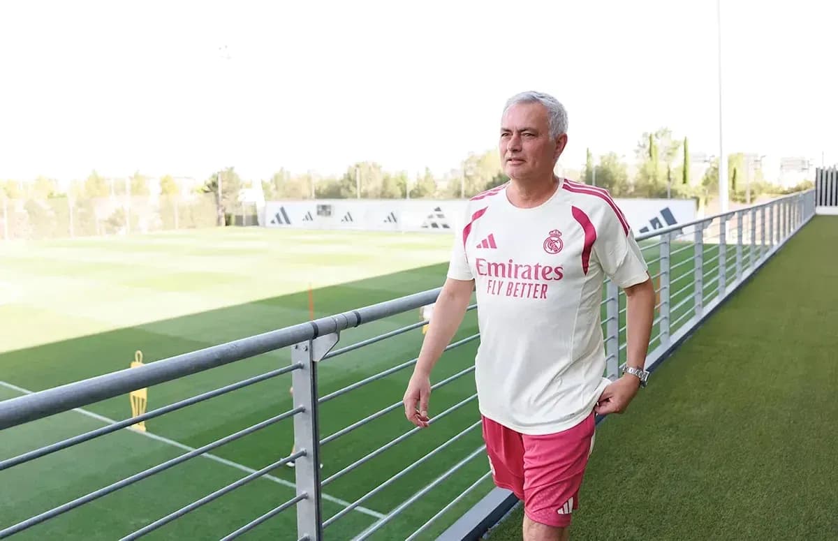 Manager walking on training pitch at facility