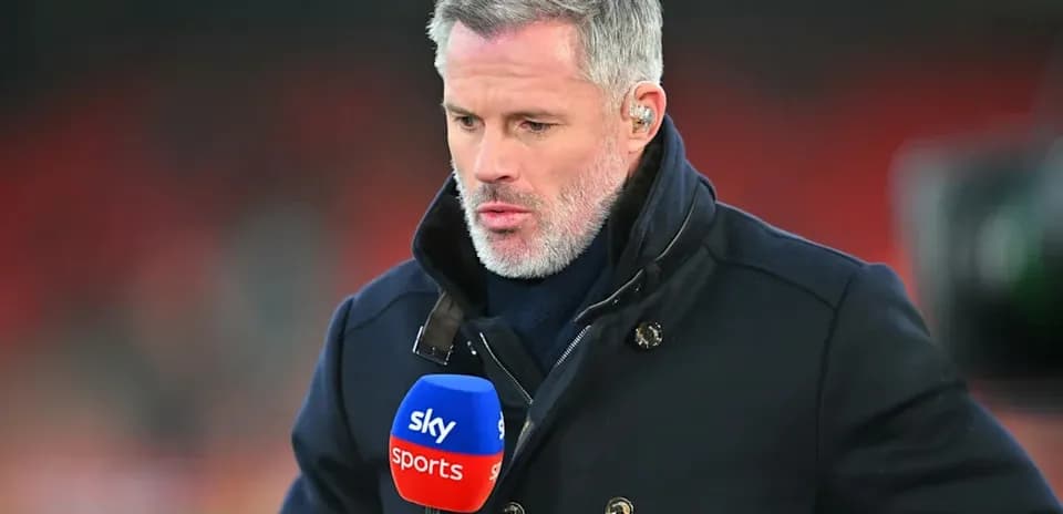 Sports analyst holding microphone during broadcast