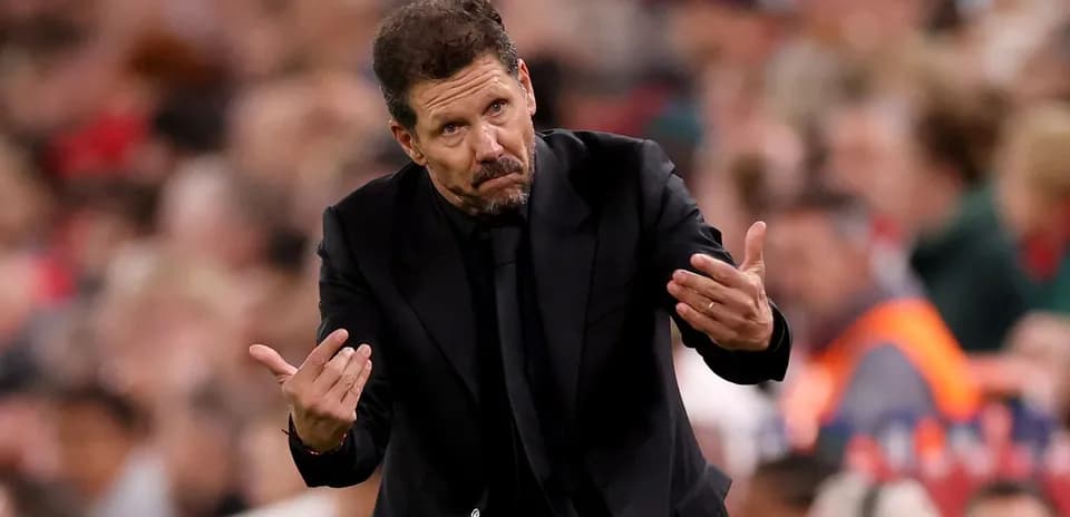 Coach gesturing during a match on the sideline