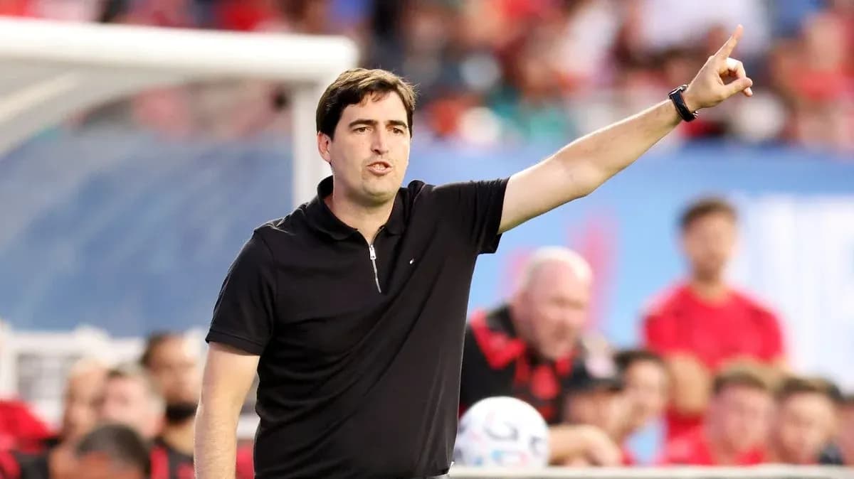 Coach giving instructions from the sideline during match