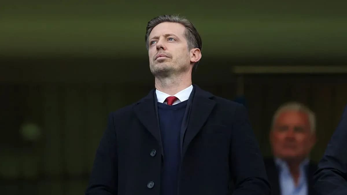 Man observing from the stands during a match