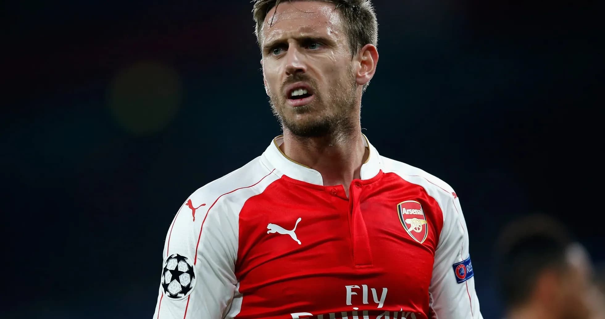 Arsenal player in red jersey during match