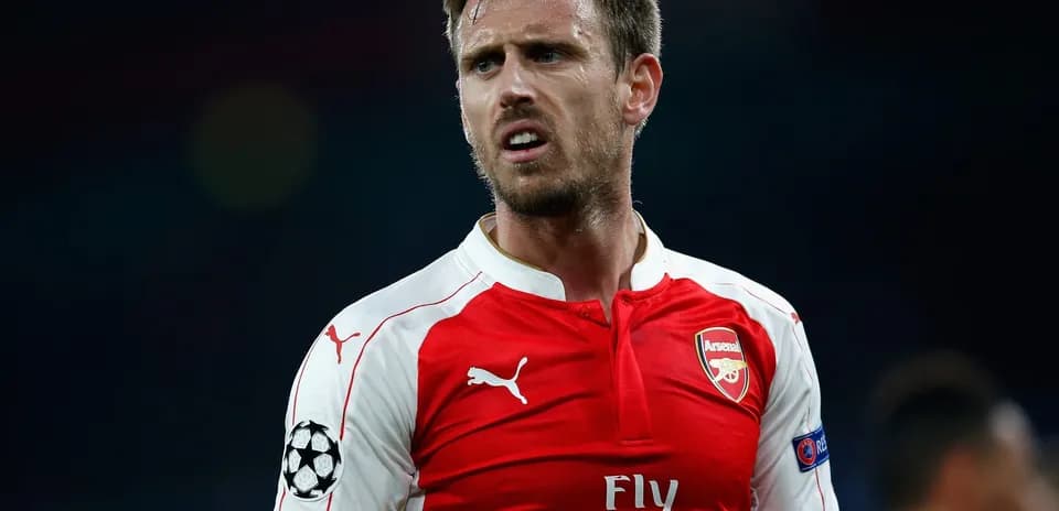 Arsenal player in red jersey during match