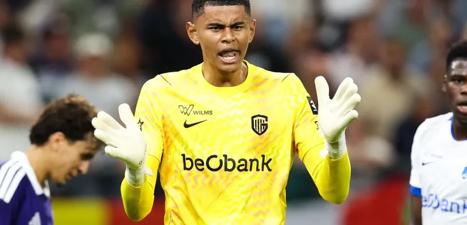Goalkeeper in yellow kit gesturing during match