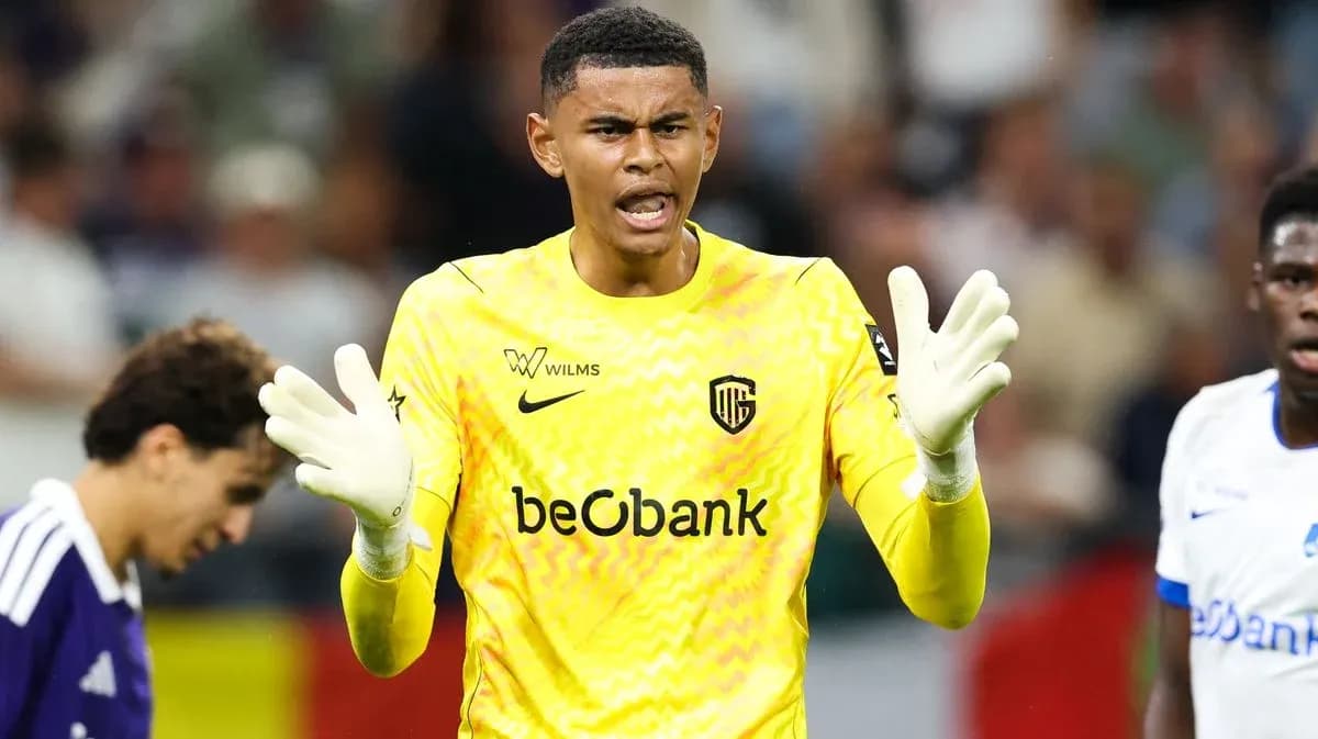 Goalkeeper in yellow kit gesturing during match