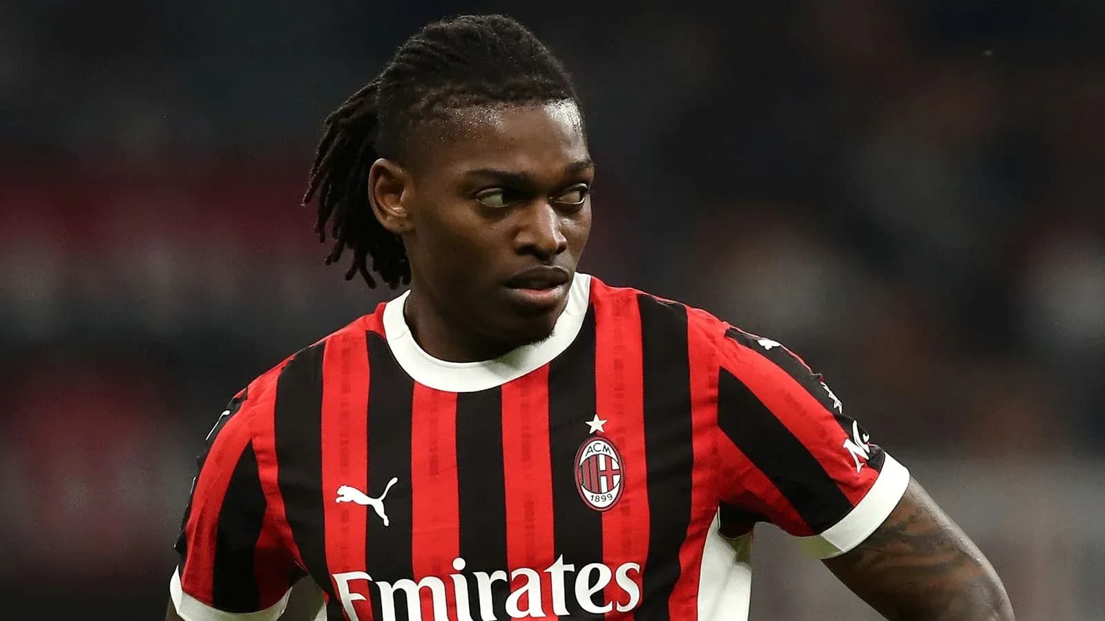 Player in AC Milan jersey during a match