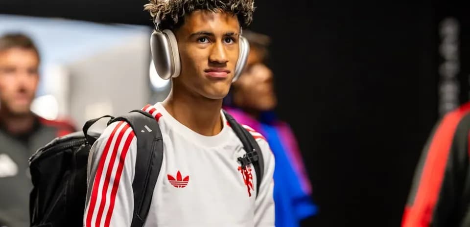 Player wearing headphones entering the venue