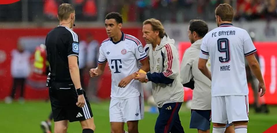 Bayern Munich players interacting with the referee during match