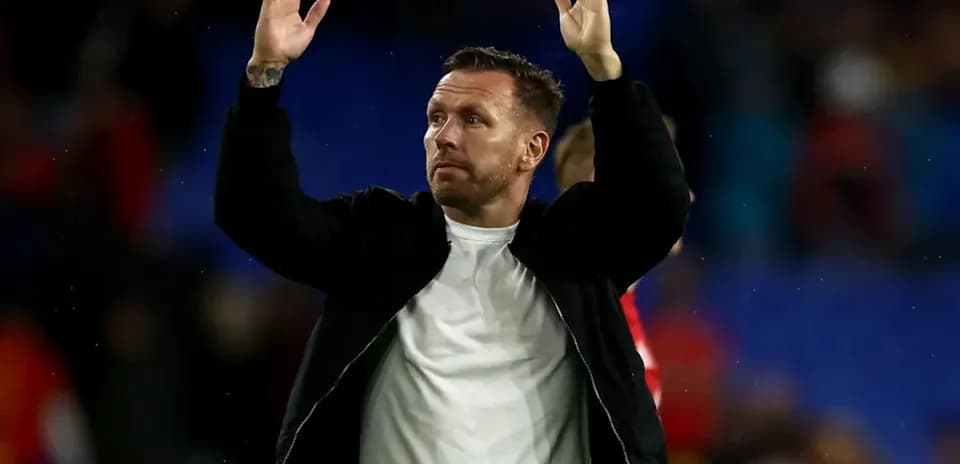 Man waving to fans after the match