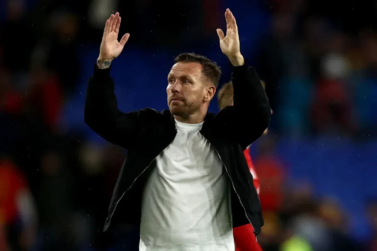 Man waving to fans after the match