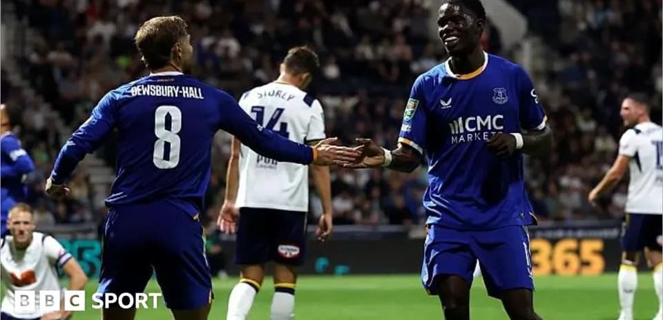 Two players celebrating during a football match